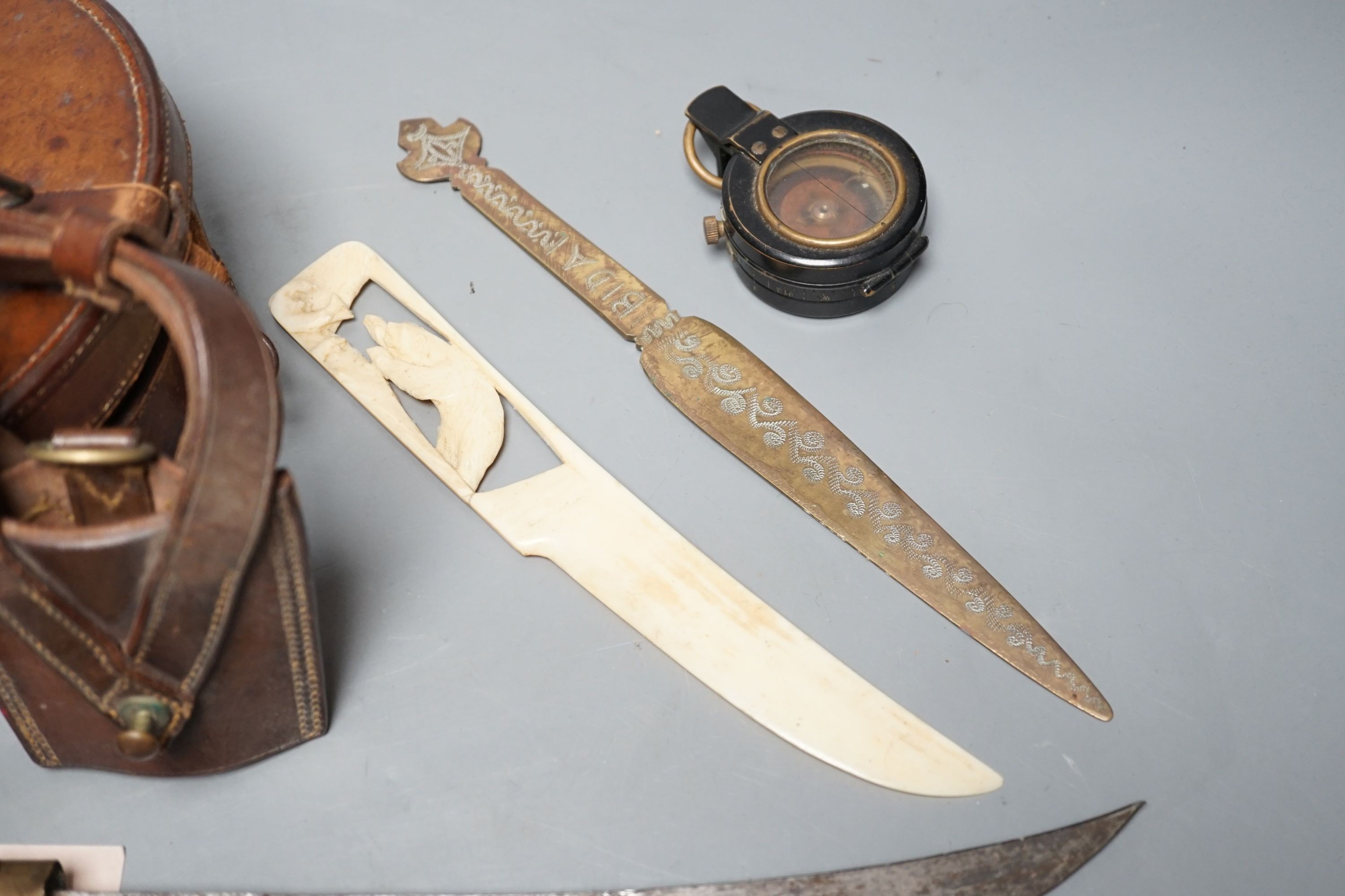 An Eastern dagger, in sheath, leather collars box, cased early 20th century Dollond compass and three others